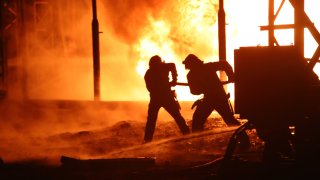 Firefighters of the State Emergency Service work to put out the fire that erupted after a Russian missile attack at an energy facility in the Kharkiv region of northeastern Ukraine. On Sunday evening, Russian invaders launched 11 cruise missiles at critical civilian infrastructures in Ukraine, strikes which were seen as “revenge” for its reclaiming of occupied land.