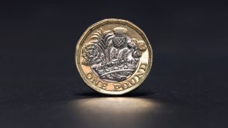 A British one pound coin sits in this arranged photograph in London, U.K.