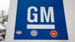 This Oct. 16, 2019, file photo shows a sign at a General Motors facility in Langhorne, Pa.
