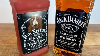 bottle of Jack Daniel's Tennessee Whiskey is displayed next to a Bad Spaniels dog toy