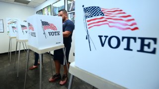 TOPSHOT – Voters cast their ballots for Early Voting at the Los Angeles County Registrar’s Office in Norwalk, California on November 5, 2018, a day ahead the November 6 midterm elections in the United States. (Photo by Frederic J. BROWN / AFP)        (Photo credit should read FREDERIC J. BROWN/AFP via Getty Images)