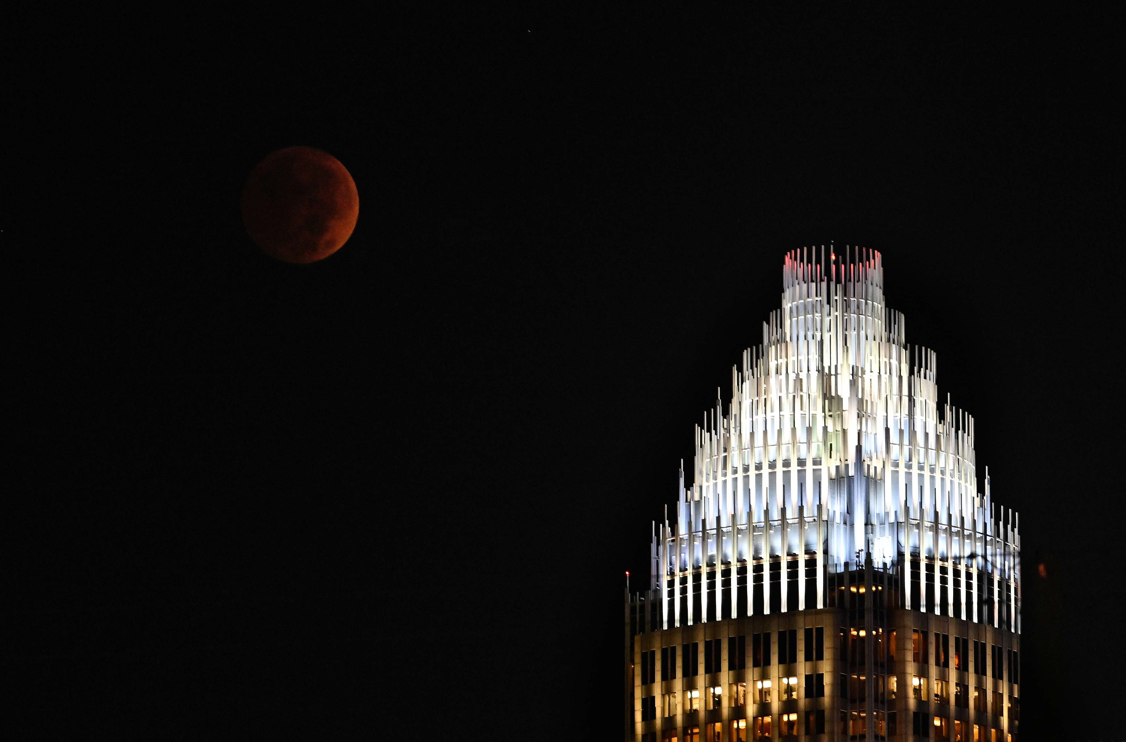 The last blood moon of 2022 – and for the next three years – hangs above the skies of Charlotte, North Carolina, Nov. 8, 2022.