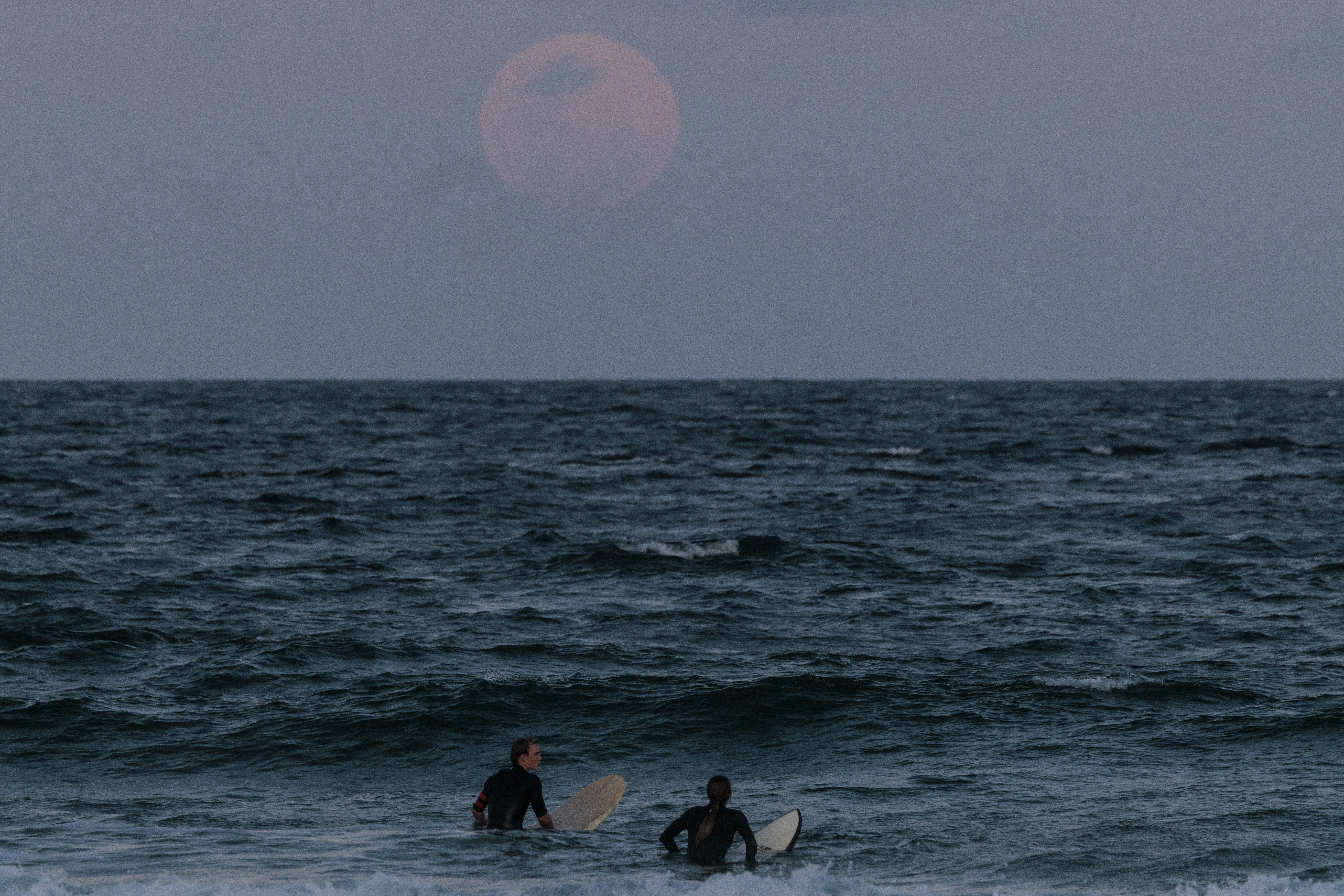 The full moon rises at Manly Beach ahead of a total lunar eclipse in Sydney on Nov. 8, 2022, in Sydney, Australia. This was the first visible total lunar eclipse of the year for Australians and people in New Zealand.