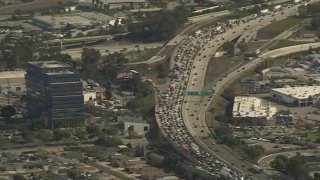 Traffic backs up on the 405 Freeway in Torrance due to a shooting investigation Thursday Nov. 17, 2022.