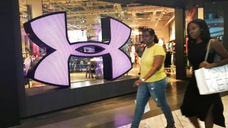 Shoppers pass an Under Armour store in White Plains, New York.