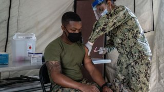A United States Marine receives the Moderna coronavirus vaccine at Camp Foster on April 28, 2021 in Ginowan, Japan.