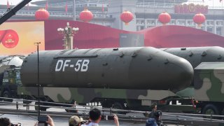 Military vehicles carrying DF-5B intercontinental ballistic missiles participate in a military parade at Tiananmen Square in Beijing on October 1, 2019, to mark the 70th anniversary of the founding of the Peoples Republic of China.