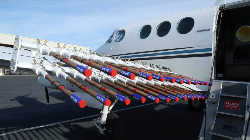 The wings of this cloud seeding plane are loaded with silver-iodide containing flares in Modesto, California
