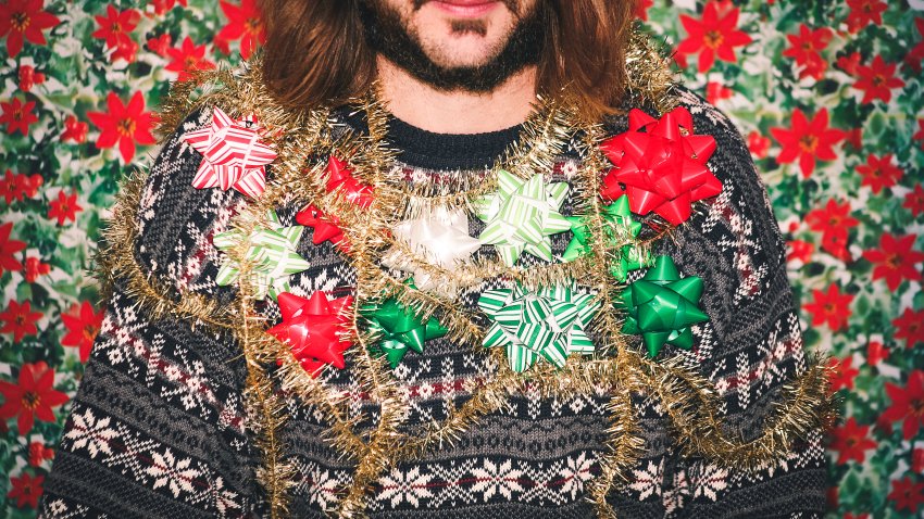 Man Wearing Ugly Holiday Sweater.