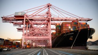 05 November 2022, South Korea, Pusan: Containers are loaded from the container freighter “Alula Express” at Busan Newport International Terminal, one of the largest container ports in the world. Photo: Bernd von Jutrczenka/dpa (Photo by Bernd von Jutrczenka/picture alliance via Getty Images)