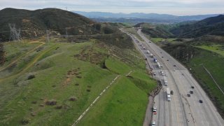 Lanes are closed on a stretch of the 5 Freeway in northern Los Angeles County due a mudslide triggered by steady weekend rain.