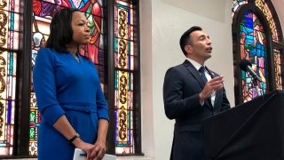 Assistant Attorney General of the U.S. Department of Justice’s Civil Rights Division Kristen Clarke, left, listens as United States Attorney Martin Estrada, of the California central division, speaks during a news conference on Thursday, Jan. 12, 2023, at the Second Baptist Church in Los Angeles.