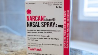 Close-up of box with logo for Narcan brand Naloxone nasal spray in domestic room, used to reverse the effects of an opioid overdose, April 11, 2020.