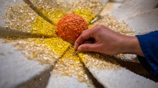Irwindale, CA – December 29: Wen Chang is using tweezers as she pays close attention to details while working on a float at Fiesta Parade Floats on Thursday, Dec. 29, 2022, in Irwindale, CA. (Francine Orr / Los Angeles Times via Getty Images)