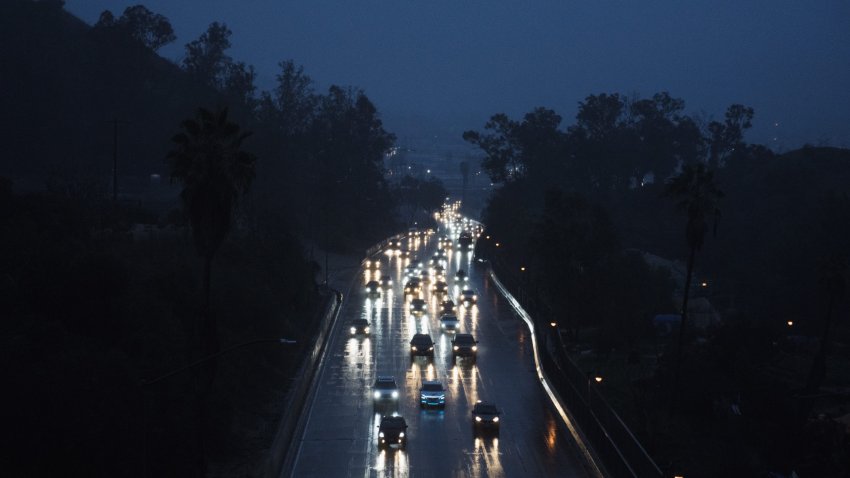 Traffic on a freeway during a rain storm in Los Angeles, California, US, on Thursday, Jan. 5, 2023. A powerful storm with hurricane-force gusts has begun to wind down after ripping across California, leaving behind power outages, flood threats and road closures just hours before another drenching is set to wash over the state. Photographer: Eric Thayer/Bloomberg via Getty Images