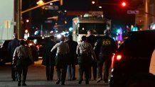 Investigators from the Los Angeles County Sheriff's Department Homicide bureau walk away after briefing the media in Monterey Park, California  on January 22, 2023. - Ten people have died and at least 10 others been wounded in a mass shooting in a largely Asian city in southern California, law enforcement said January 22, with the suspect still at large hours later. (Photo by Frederic J. BROWN / AFP) (Photo by FREDERIC J. BROWN/AFP via Getty Images)