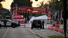 TOPSHOT - Police work near the scene of a mass shooting in Monterey Park, California, on January 22, 2023. - Ten people have died and at least 10 others have been wounded in a mass shooting in a largely Asian city in southern California, police said, with the suspect still at large hours later. (Photo by Robyn BECK / AFP) (Photo by ROBYN BECK/AFP via Getty Images)