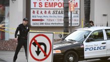 Policemen work near the scene of a mass shooting in Monterey Park, California, on January 22, 2023. - Ten people have died and at least 10 others have been wounded in a mass shooting in a largely Asian city in southern California, police said, with the suspect still at large hours later. (Photo by Robyn BECK / AFP) (Photo by ROBYN BECK/AFP via Getty Images)