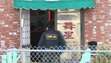 An investigator walks into the scene of a mass shooting in Monterey Park, California, on January 22, 2023. - Ten people have died and at least 10 others have been wounded in a mass shooting in a largely Asian city in southern California, police said, with the suspect still at large hours later. (Photo by Robyn BECK / AFP) (Photo by ROBYN BECK/AFP via Getty Images)