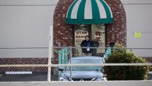 An investigator works at the scene of a mass shooting in Monterey Park, California, on January 22, 2023. - Ten people have died and at least 10 others have been wounded in a mass shooting in a largely Asian city in southern California, police said, with the suspect still at large hours later. (Photo by Robyn BECK / AFP) (Photo by ROBYN BECK/AFP via Getty Images)