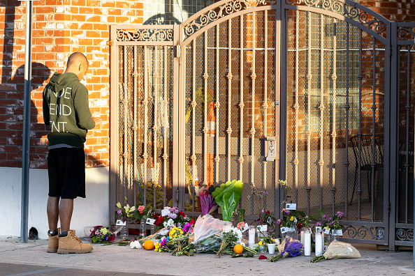 A memorial grows outside the Montery Park Dance Studio Shooting Site