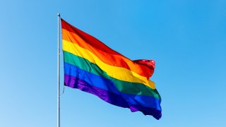 Rainbow LGBTQI flag waving in the wind