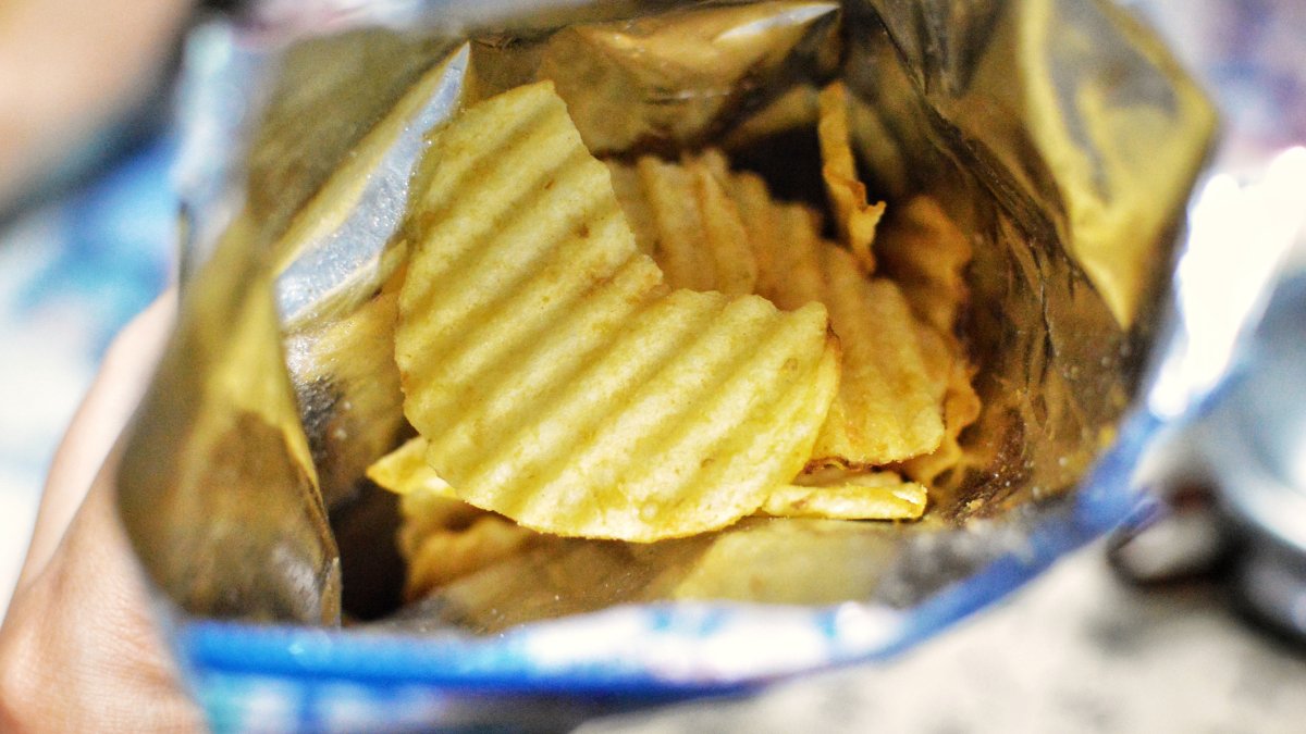 The Surprising Reason Your Potato Chip Bag Is Only Half-Full