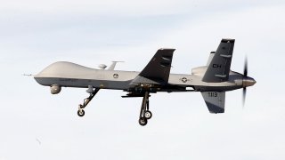 An MQ-9 Reaper remotely piloted aircraft (RPA) flies by during a training mission at Creech Air Force Base on November 17, 2015 in Indian Springs, Nevada.