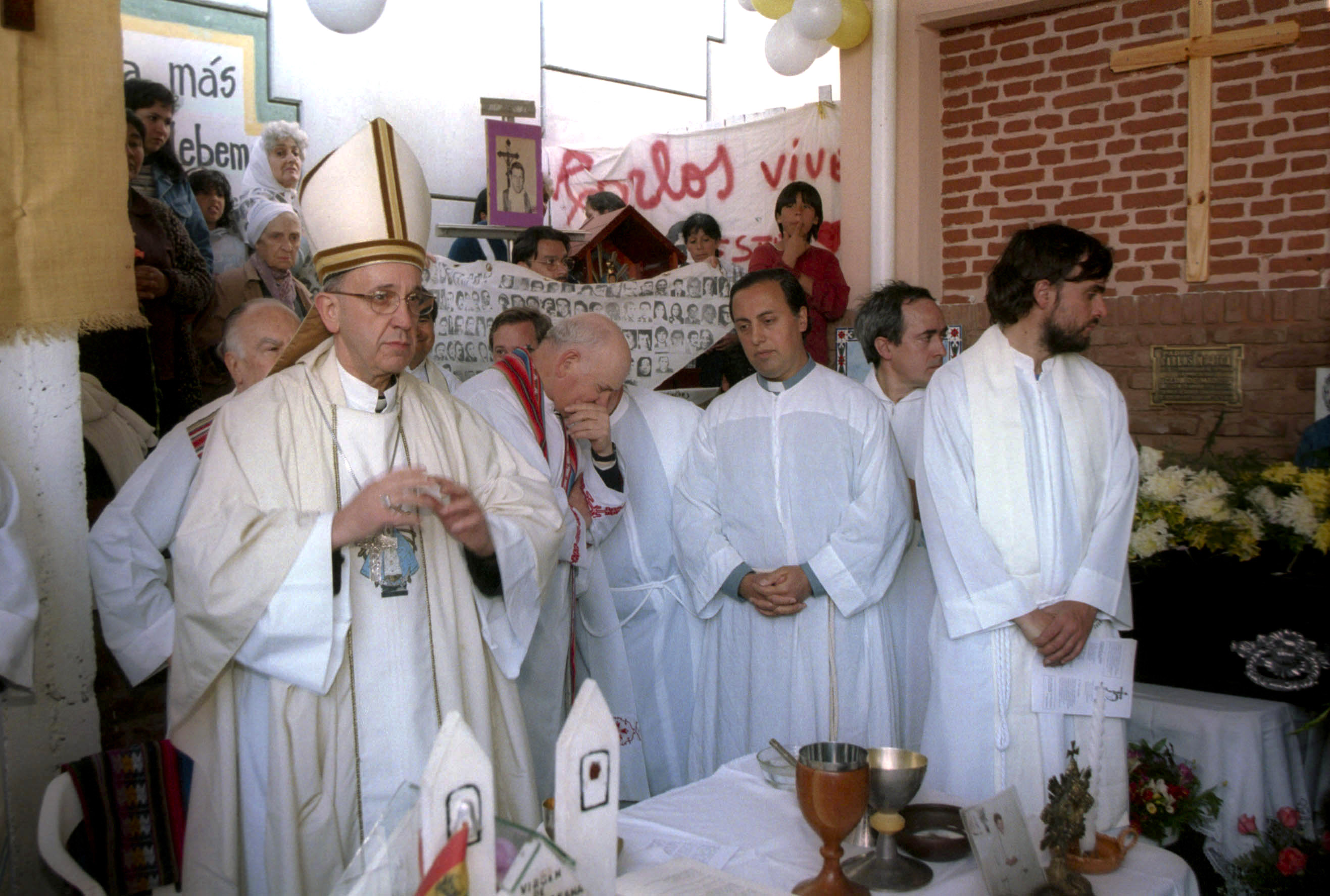 In this 2000 photo, Argentina’s Archbishop Jorge Mario Bergoglio, left, gives a mass in honor of slain Priest Carlos Mugica, the day his remains were taken to the Villa 31 slum in Buenos Aires, Argentina. Mugica was born in Buenos Aires in 1930 and worked with the needy, advocating liberation theology in Buenos Aires’ slums. He was assassinated in 1974, two years before Argentina’s dictatorship, by the Argentine Anti-Communist Alliance, a right-wing death squad, when he had just finished celebrating mass in Buenos Aires. Every significant slum in Buenos Aires has a church, thanks in part to Bergoglio, who was elected pope on March 13, 2013.