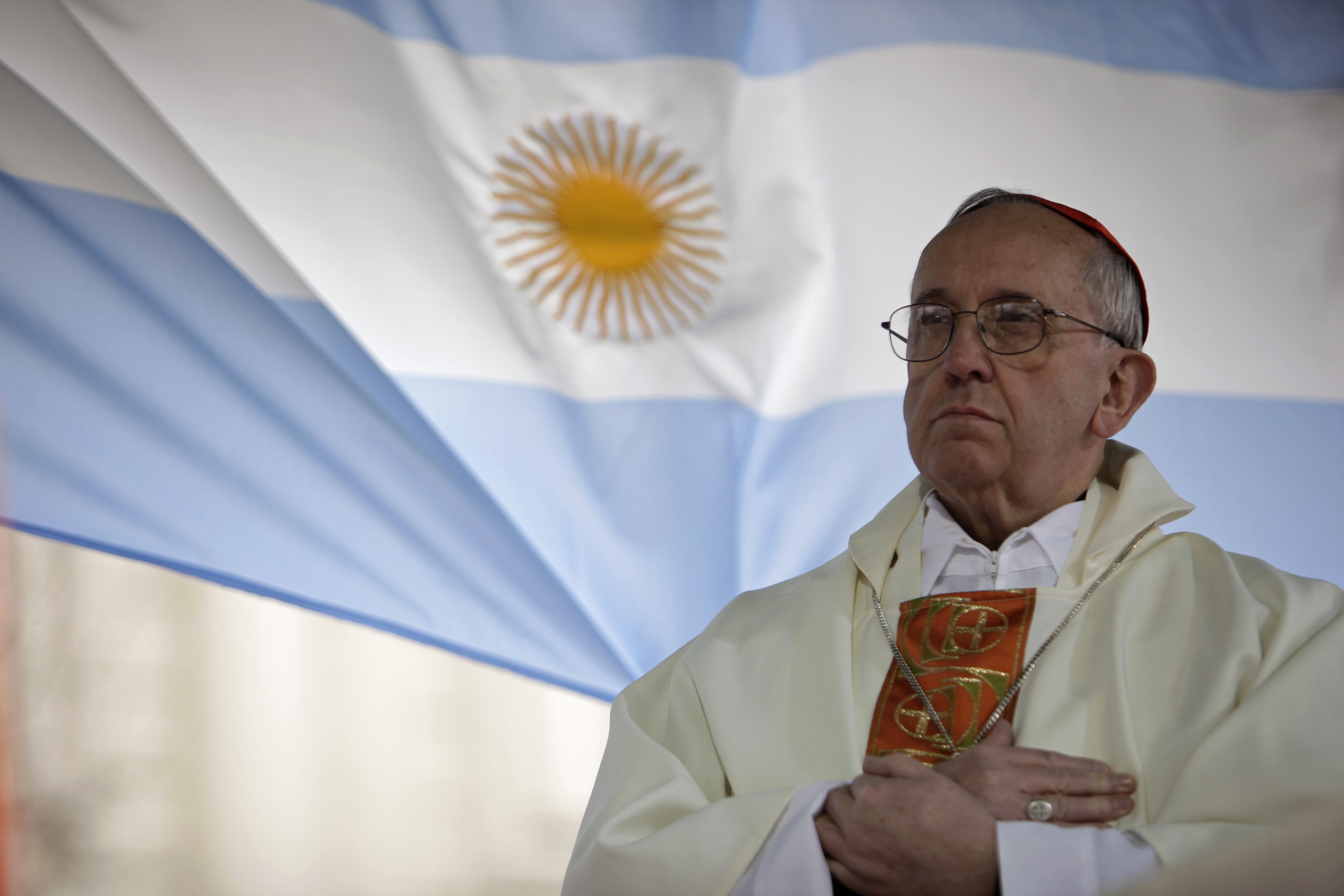 This Aug. 7, 2009 file photo shows Argentina’s Cardinal Jorge Bergoglio giving a mass outside the San Cayetano church in Buenos Aires.