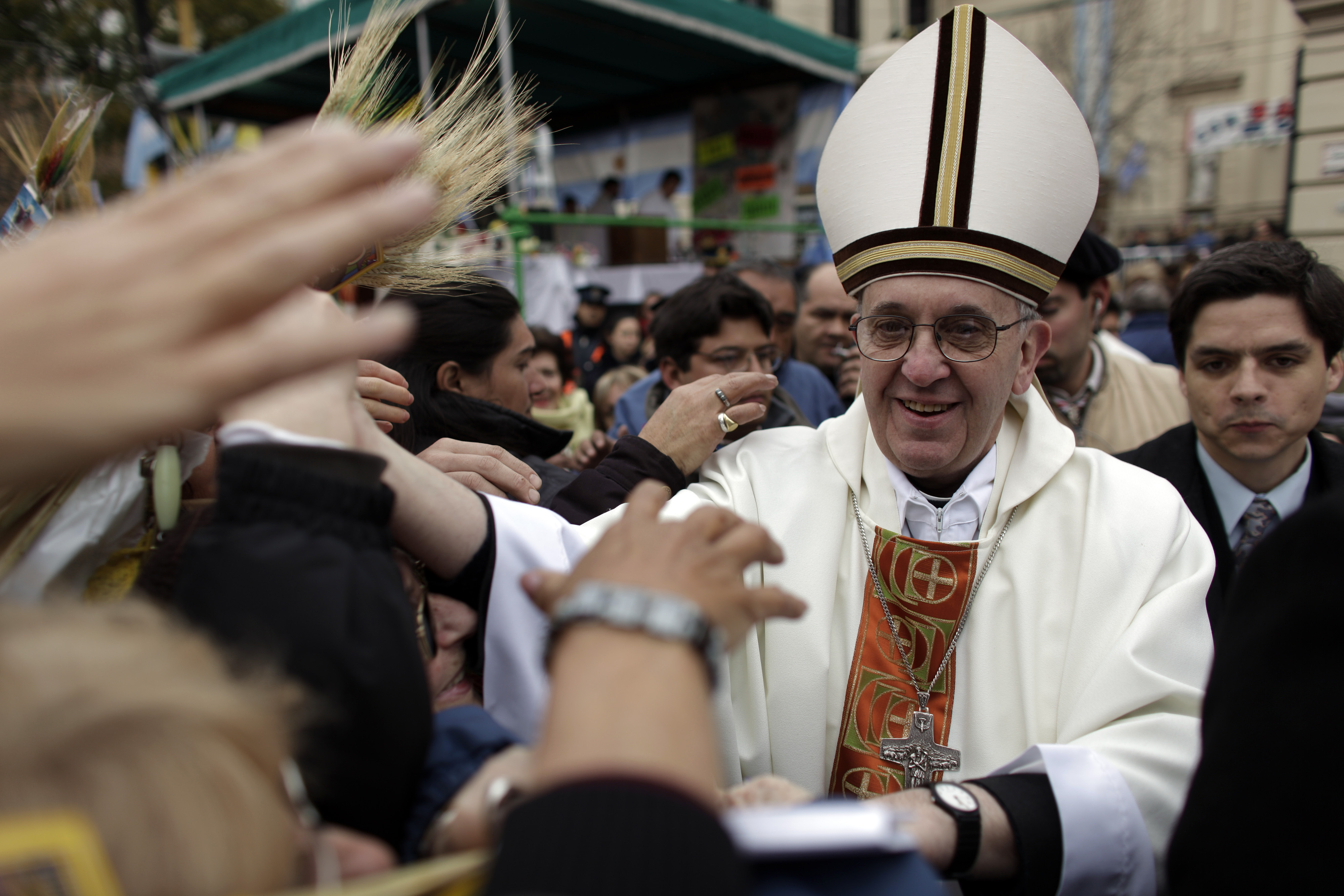 This Aug. 7, 2009 file photo shows Argentina’s Cardinal Jorge Bergoglio giving a mass outside San Cayetano church in Buenos Aires.