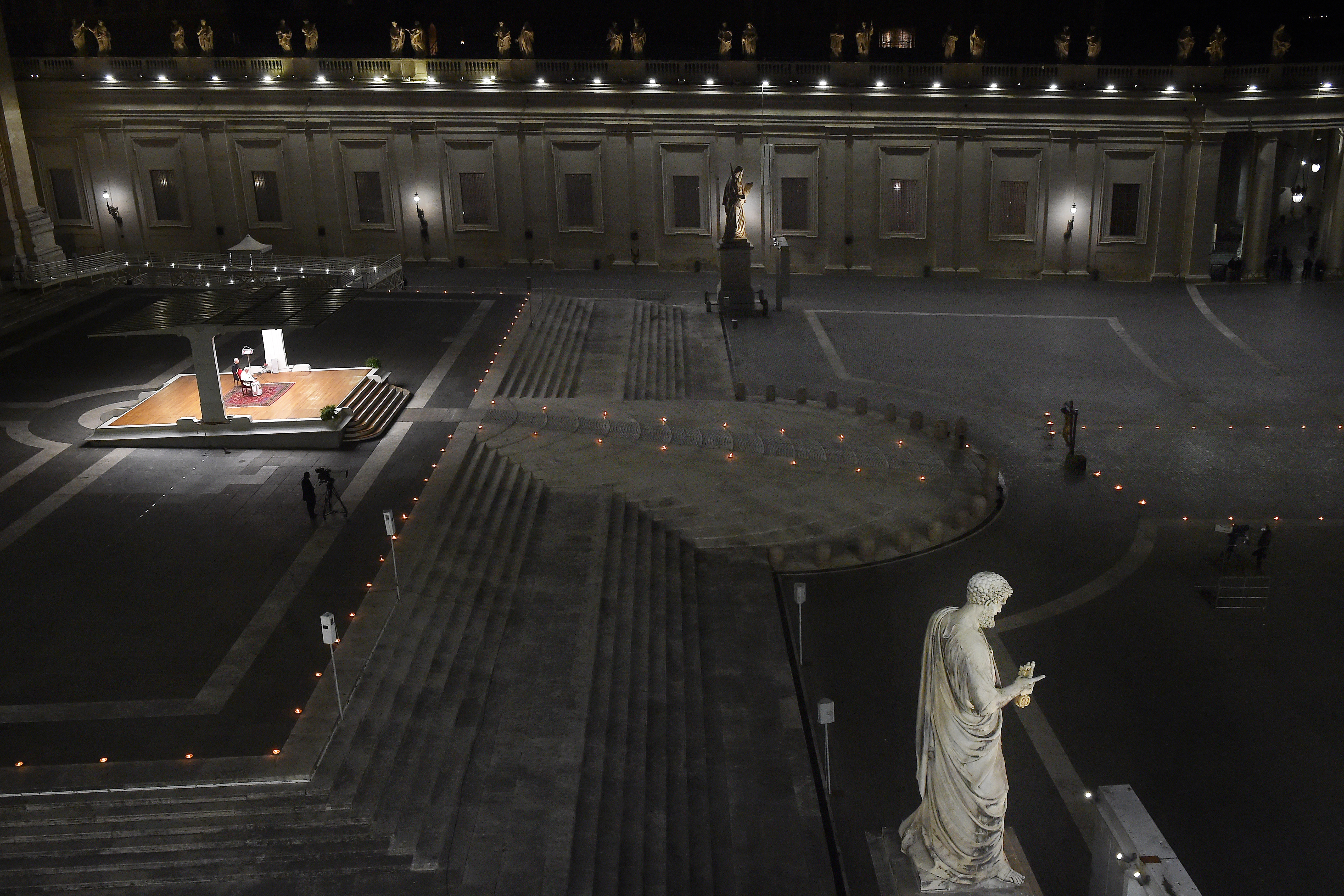 Pope Francis presides over the Way of the Cross in a near empty  St. Peter’s Square, due to the Covid-19 pandemic on April 10, 2020 in Vatican City, Vatican. It marked a stark departure from the usual ceremony, which normally takes place at the Colosseum amid throngs of people as the Church remembers the final moments of the Passion, Death, and Burial of our Lord Jesus Christ. This year, measures taken to halt the spread of Covid-19 made it necessary to hold the service without the physical presence of the faithful.
