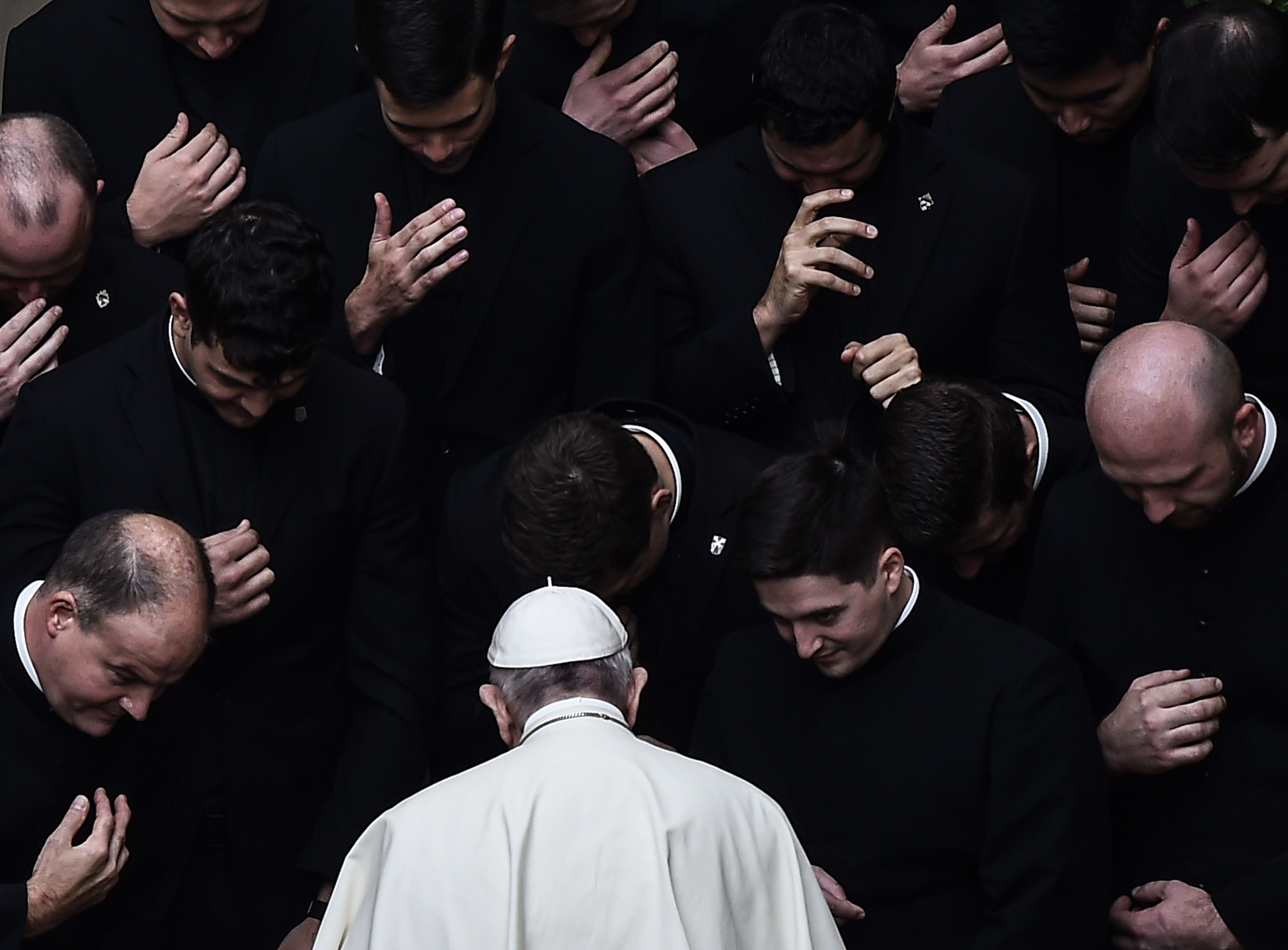 Pope Francis prays with priests at the end of a limited public audience at the San Damaso courtyard in the Vatican on Sept. 30, 2020 during the COVID-19 pandemic.