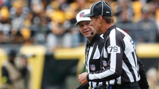 NFL referee Brad Rogers (left) and down judge Kent Payne (79) talk on the field during the game between the New York Jets and the Pittsburgh Steelers in the second quarter against at Acrisure Stadium. Mandatory Credit: Charles LeClaire-USA TODAY Sports