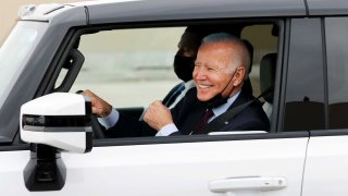 U.S. President Joe Biden gestures after driving a Hummer EV during a tour at the General Motors ‘Factory ZERO’ electric vehicle assembly plant in Detroit, Michigan, November 17, 2021.