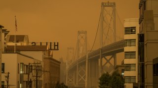 Smoke hangs over the Oakland-San Francisco Bay Bridge in San Francisco, California, on Wednesday, Sept. 9, 2020.