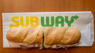 In this photo illustration, a Subway sandwich is seen on a table at a Subway restaurant on January 12, 2023, in Austin, Texas.