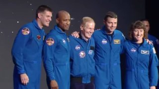 NASA Administrator Bill Nelson, center, stands with the crew of the Artemis II mission, from left: Jeremy Hansen, Victor Glover, Reid Wiseman, and Christina Koch.