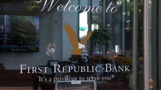 A pedestrian walks by a First Republic bank on April 26, 2023 in San Francisco, California.