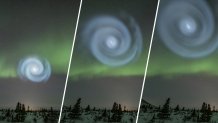 An image of an icy-blue spiral against a green ribbon of northern lights over Donnelly Dome, near Delta Junction, Alaska, April 15, 2023. Professional photographer and aurora hunter Todd Salat caught a mysterious spiral in the sky over Donnelly Dome near Delta Junction, Alaska, April 15, 2023.