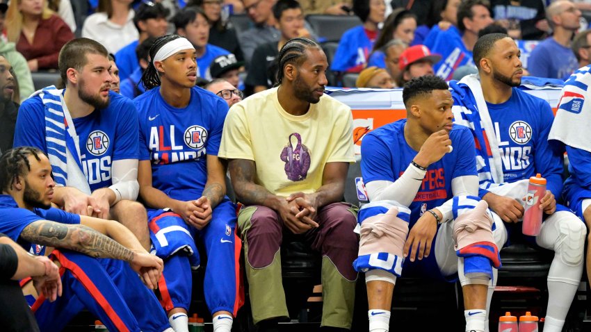 Los Angeles Clippers forward Kawhi Leonard looks on from the bench in the first half against the Phoenix Suns at Crypto.com Arena.