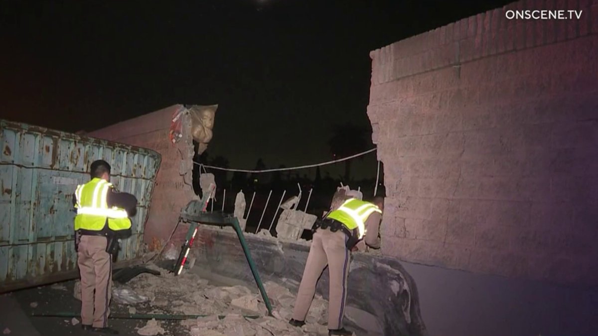 Dump Truck Crash on South 110 Launches Trash Bin Through Brick Wall