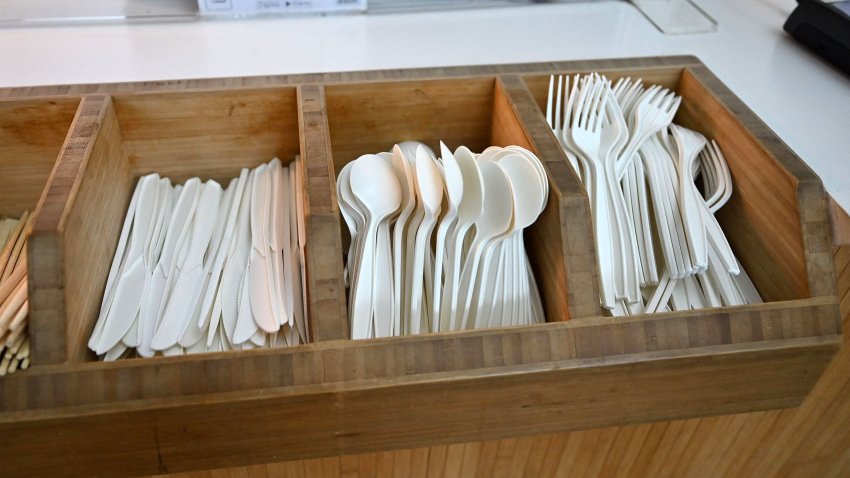 Single-use plastic cutlery is pictured in a tray at a fast-food outlet west of London on January 14, 2023. – England will ban a wide range of single-use plastic items from October including plates and cutlery in order to limit their “devastating” effect on the environment, the government said Saturday. (Photo by JUSTIN TALLIS / AFP) (Photo by JUSTIN TALLIS/AFP via Getty Images)
