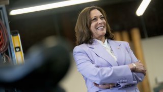 US Vice President Kamala Harris listens as she takes part in a tour of the Los Angeles Cleantech Incubator.