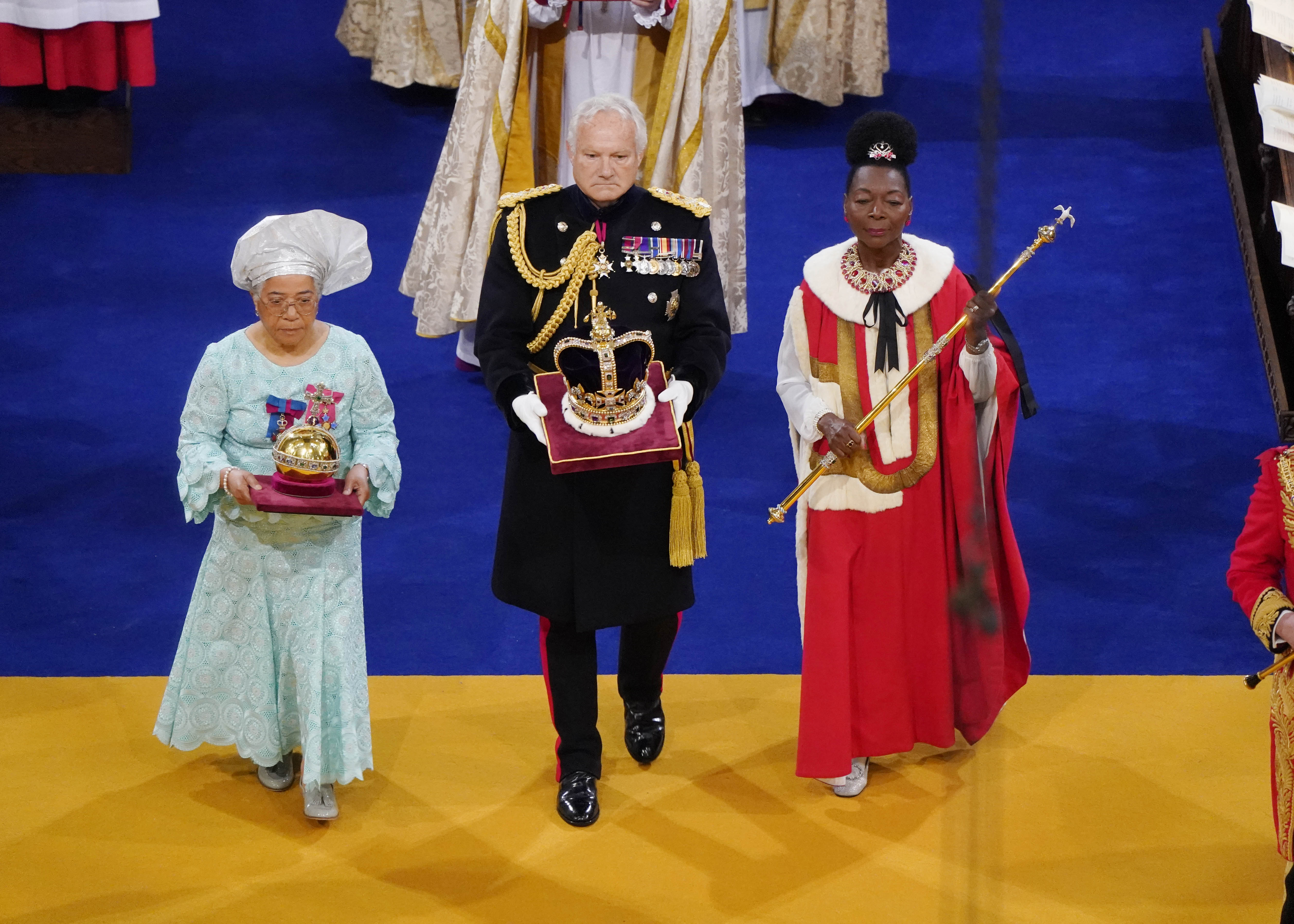 The Orb, the Sceptre with Dove and the Imperial State Crown are brought to the thrones before the coronation of King Charles III and Queen Camilla at Westminster Abbey, on May 6, 2023 in London, England.