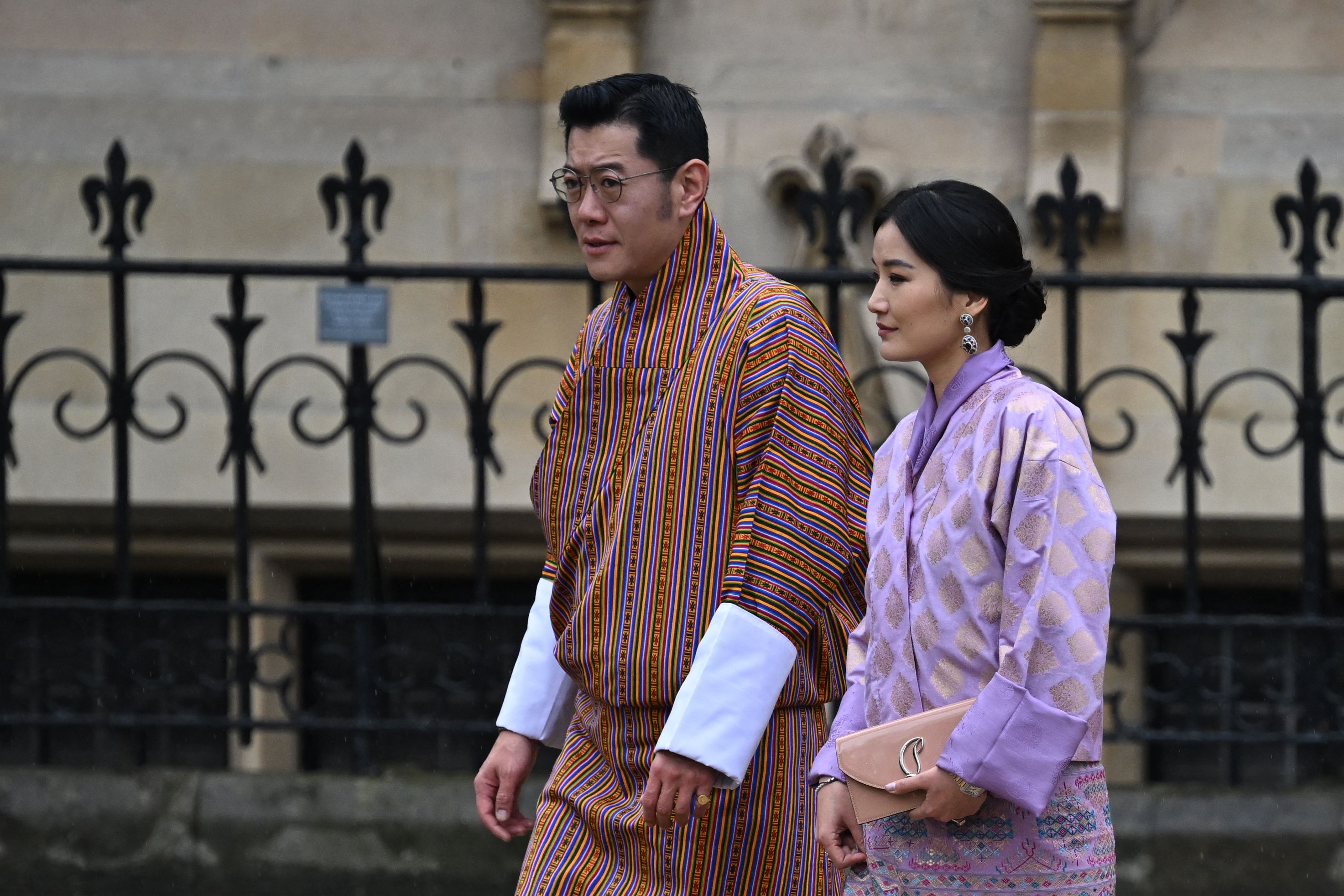 Bhutan’s King Jigme Khesar Namgyel Wangchuck and wife Jetsun Pema arrive at Westminster Abbey in central London on May 6, 2023, ahead of the coronations of Britain’s King Charles III and Britain’s Camilla, Queen Consort.