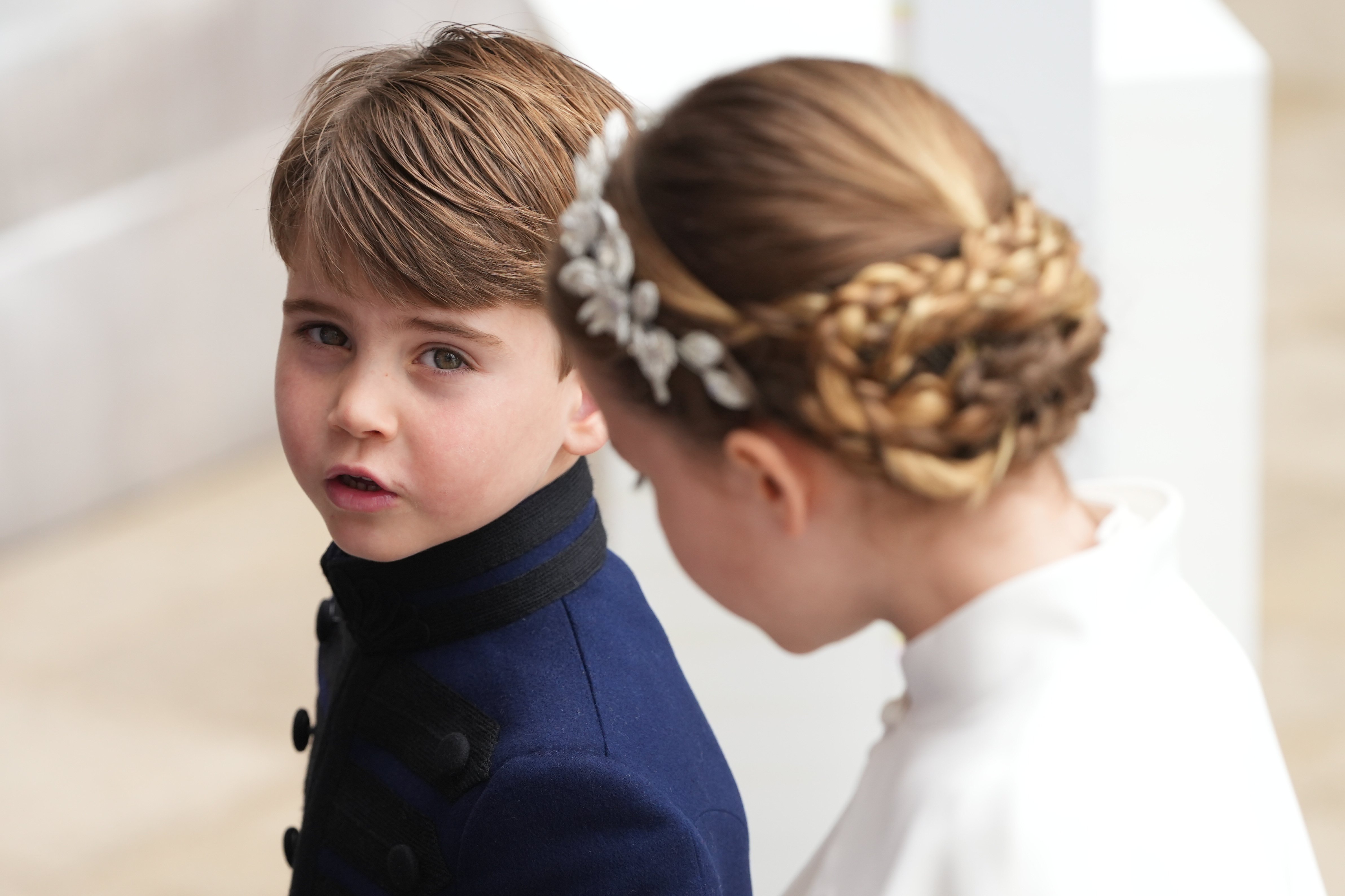 Prince Louis and Princess Charlotte arrive ahead of the Coronation of King Charles III and Queen Camilla on May 6, 2023 in London, England.