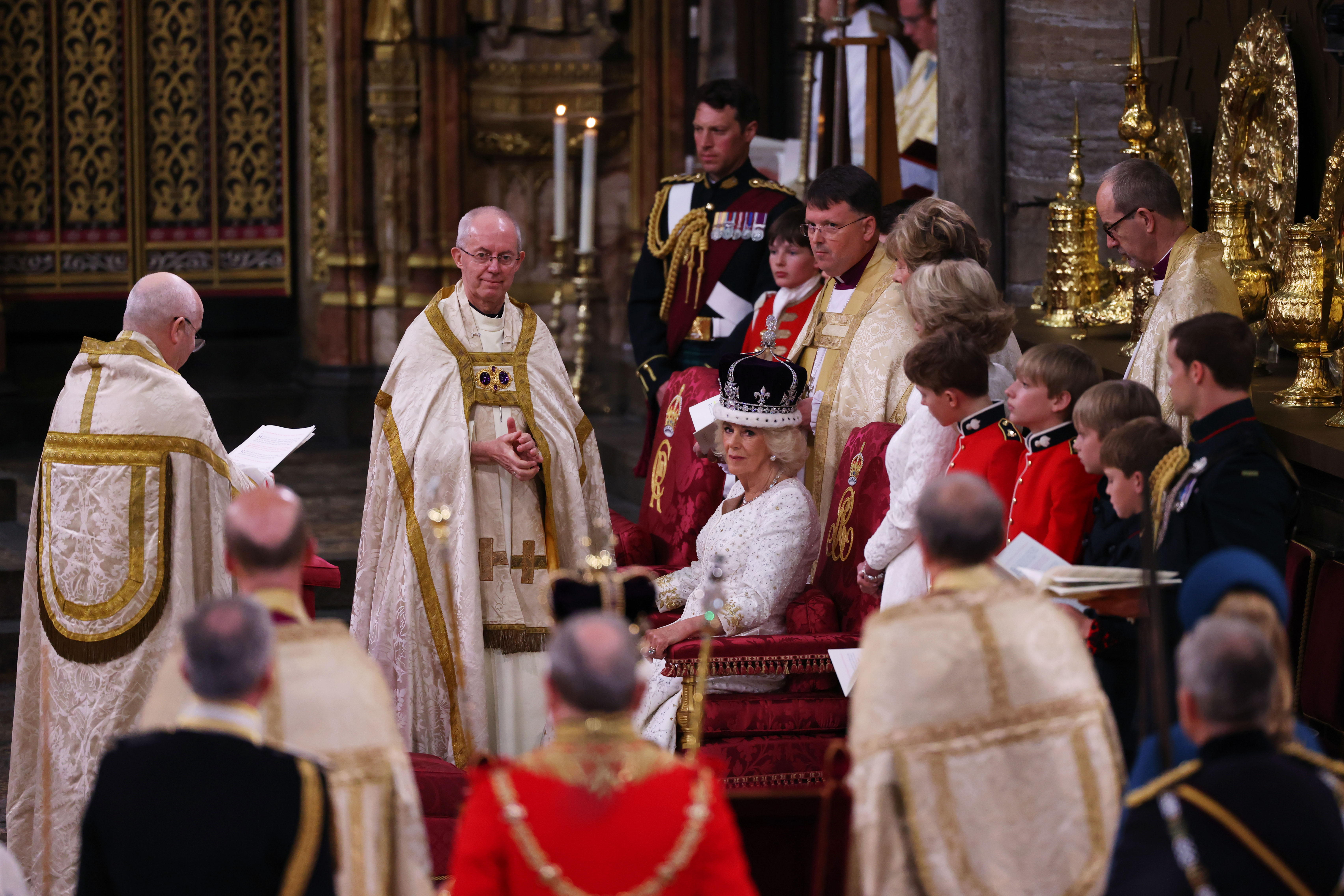 Queen Camilla is crowned by Archbishop of Canterbury Justin Welby during her coronation ceremony in Westminster Abbey, on May 6, 2023 in London, England.