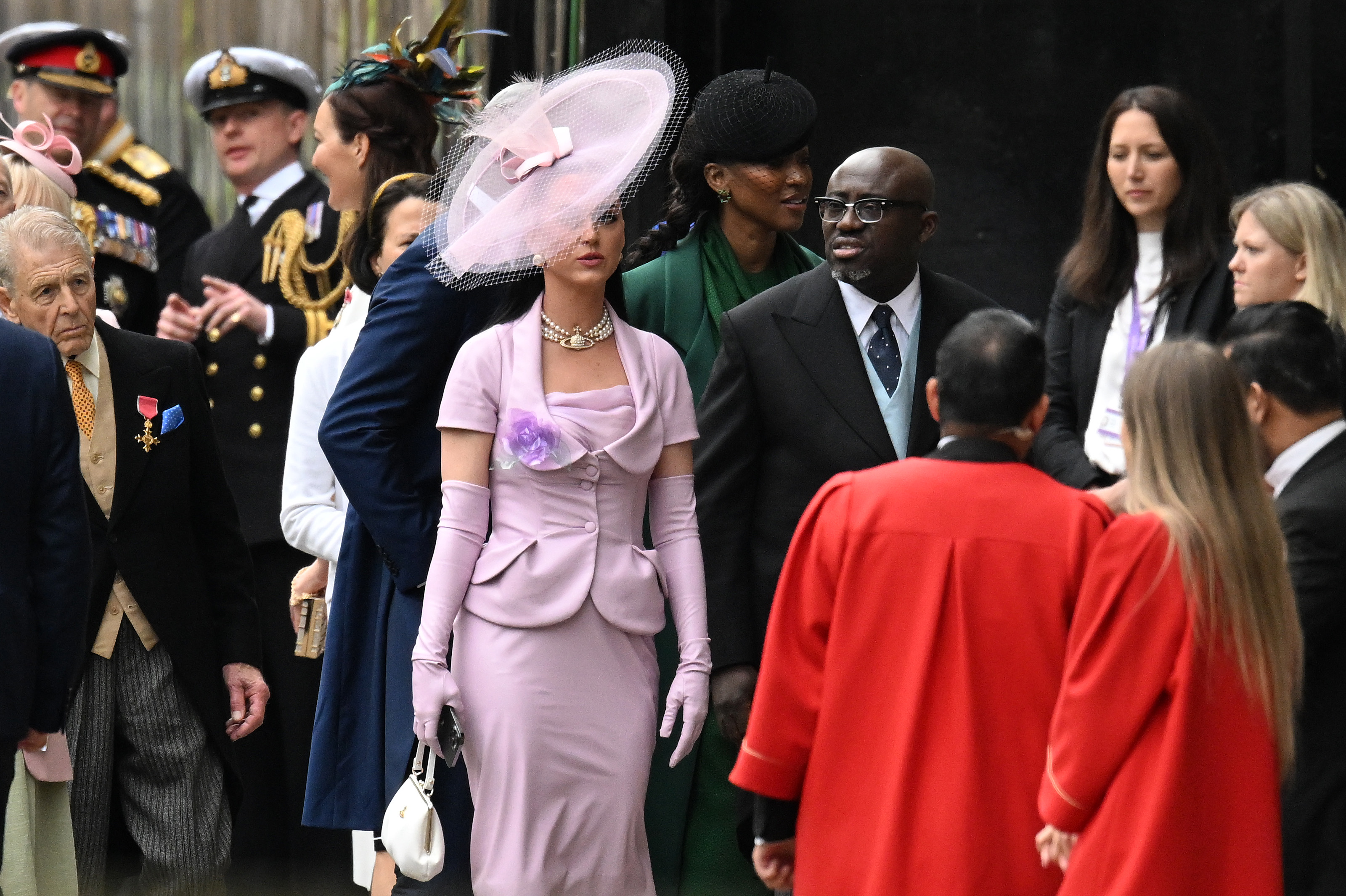 Katy Perry and Edward Enninful arrive at Westminster Abbey ahead of the Coronation of King Charles III and Queen Camilla on May 6, 2023 in London, England.