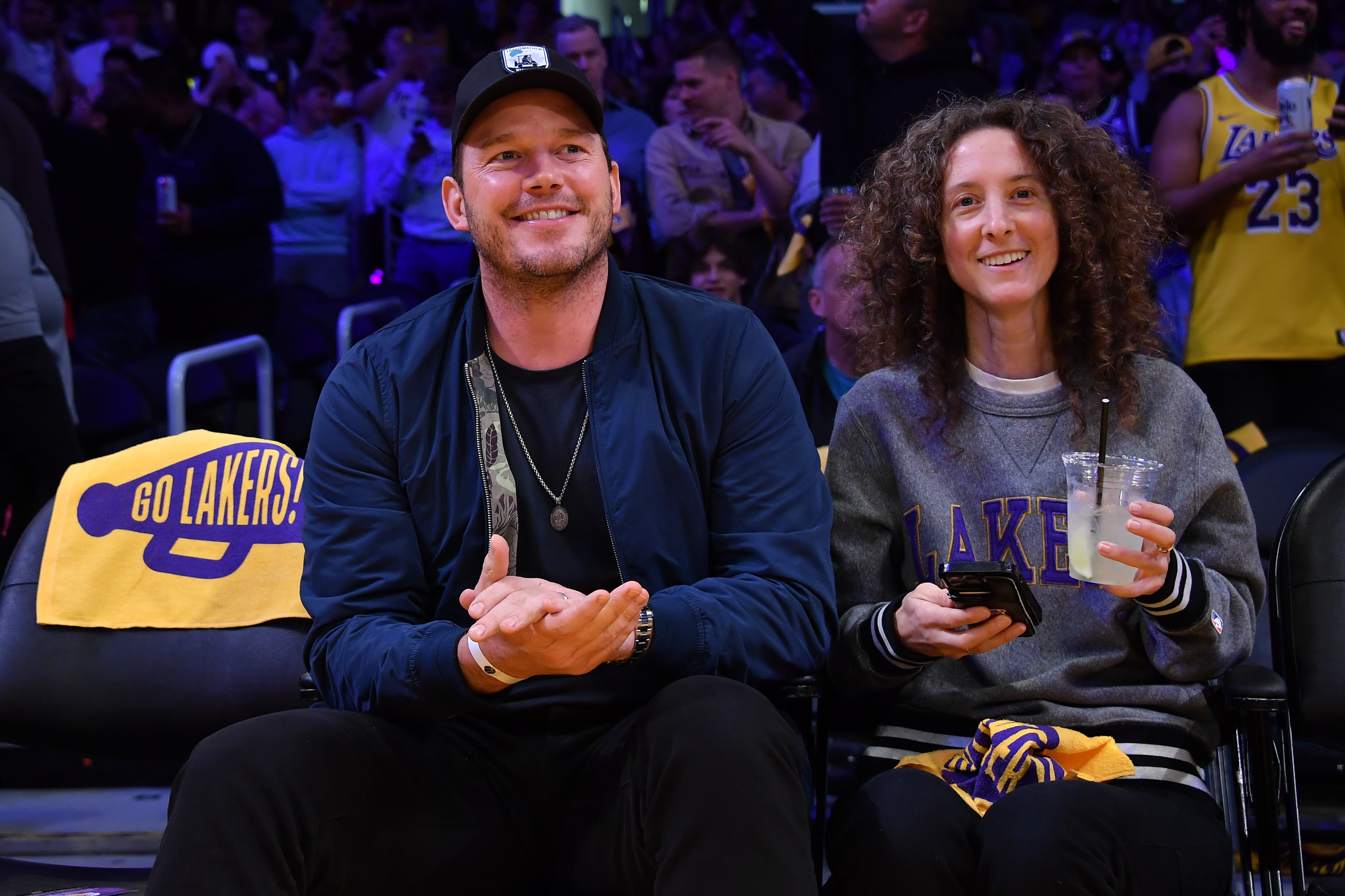 Chris Pratt attends a playoff basketball game between the Los Angeles Lakers and the Golden State Warriors.
